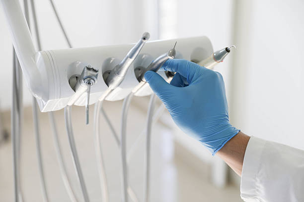 Professional Tooth Extraction technician working in K. I. Sawyer, MI